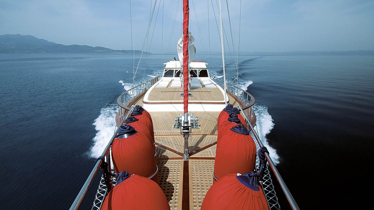 Aerial view over the bow of a 26m motor sailer under way in Turkey