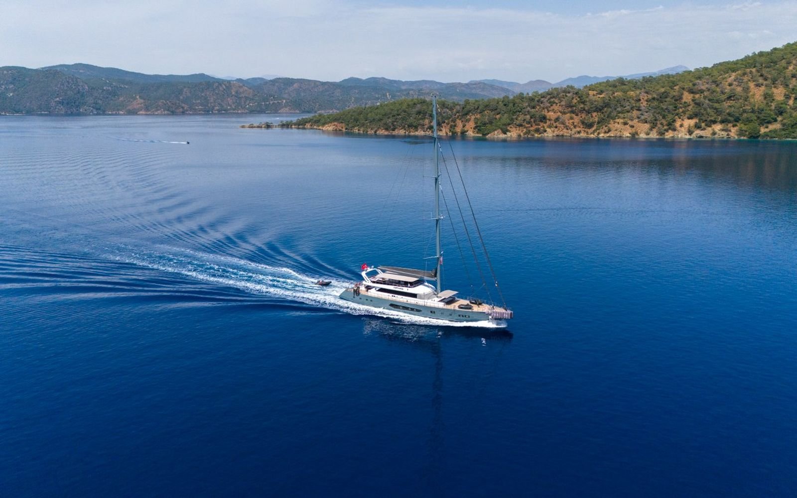 A 47m luxury sailing yacht charter cruising a secluded bay near Gocek