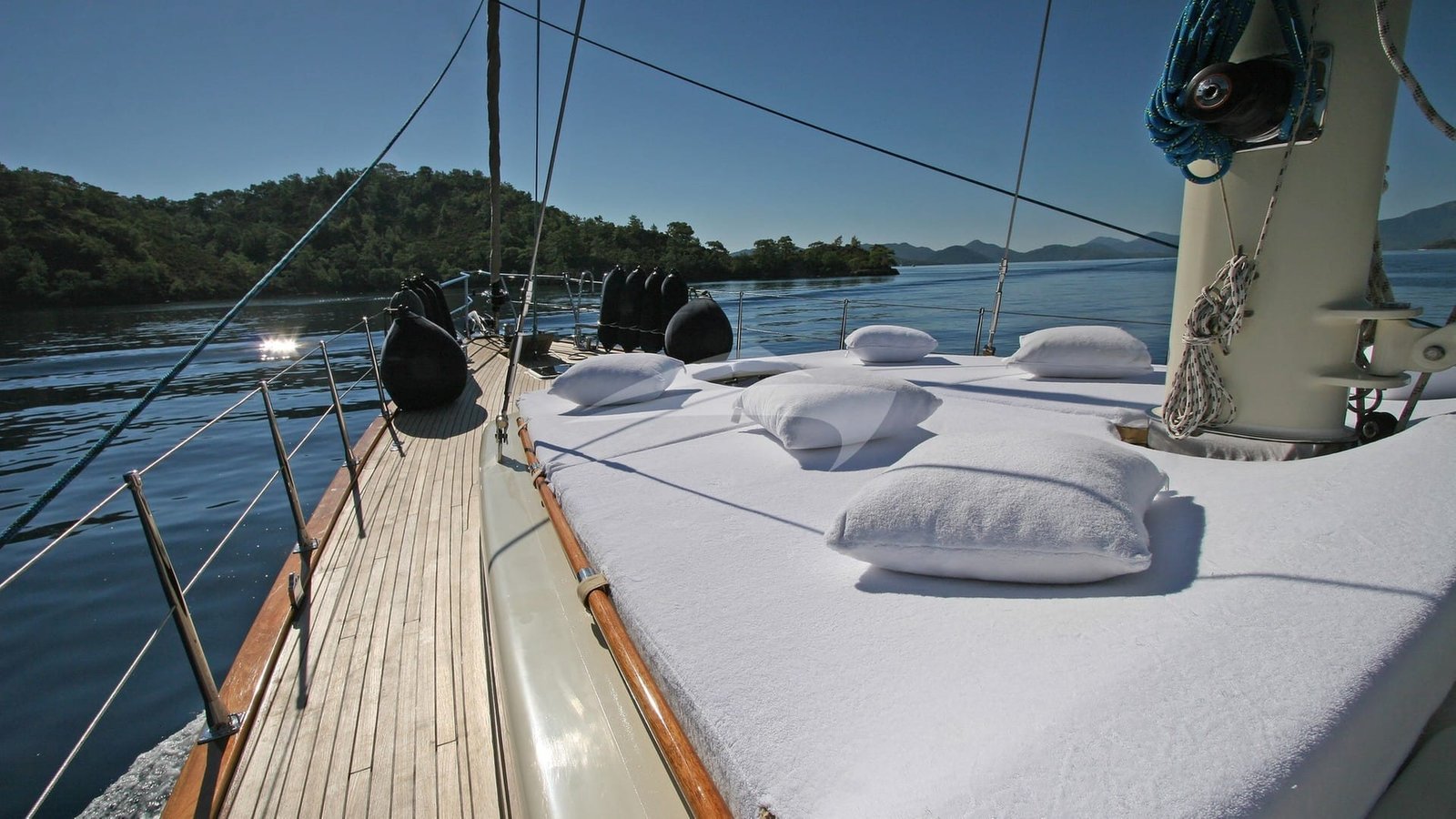 Foredeck sun pads aboard a crewed sailing yacht charter in Bodrum
