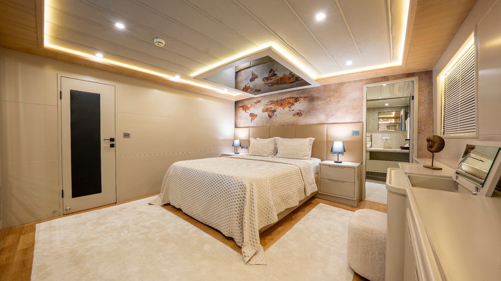 Master cabin aboard luxury trawler charter Fethiye SF2615 with king bed and vanity