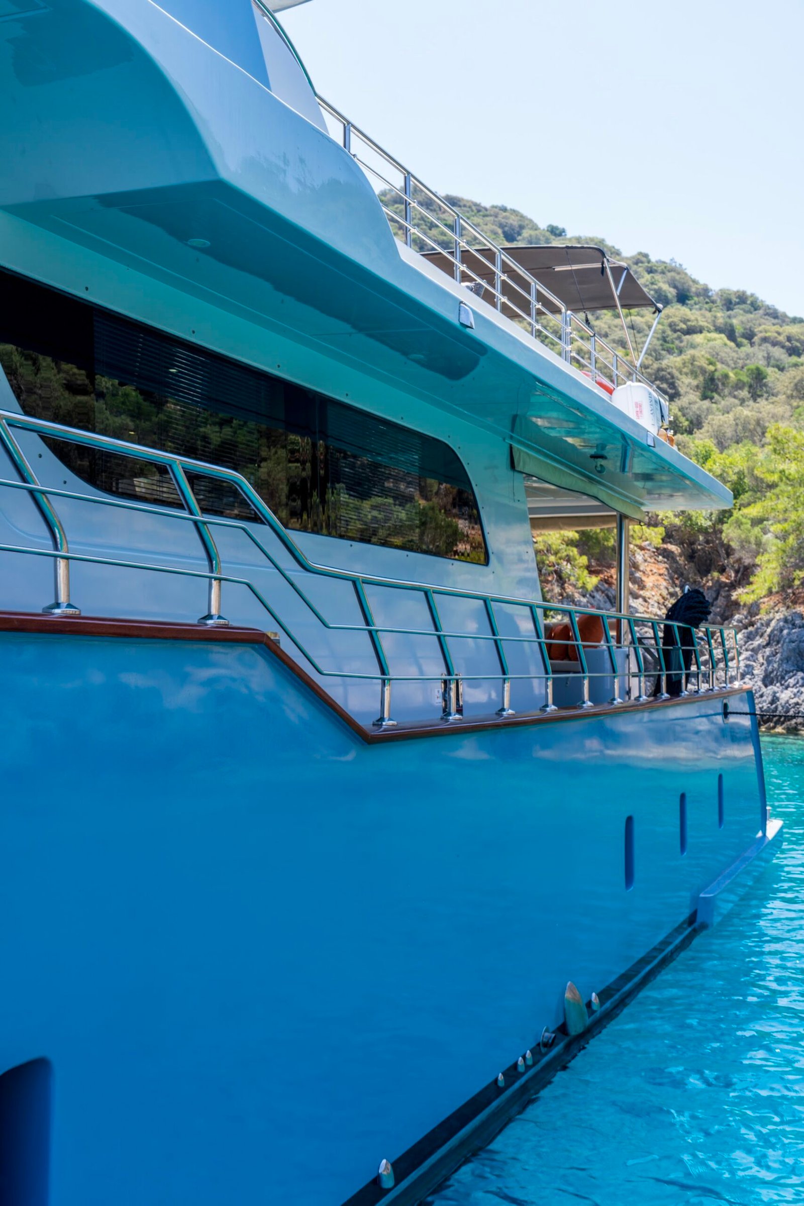 Teak side deck of luxury trawler charter Fethiye SF2615 at a quiet anchorage