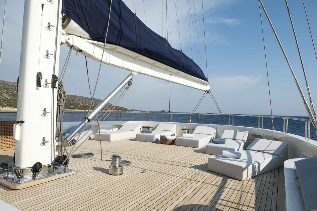 Foredeck seating beneath the foremast of a 55m sailing superyacht