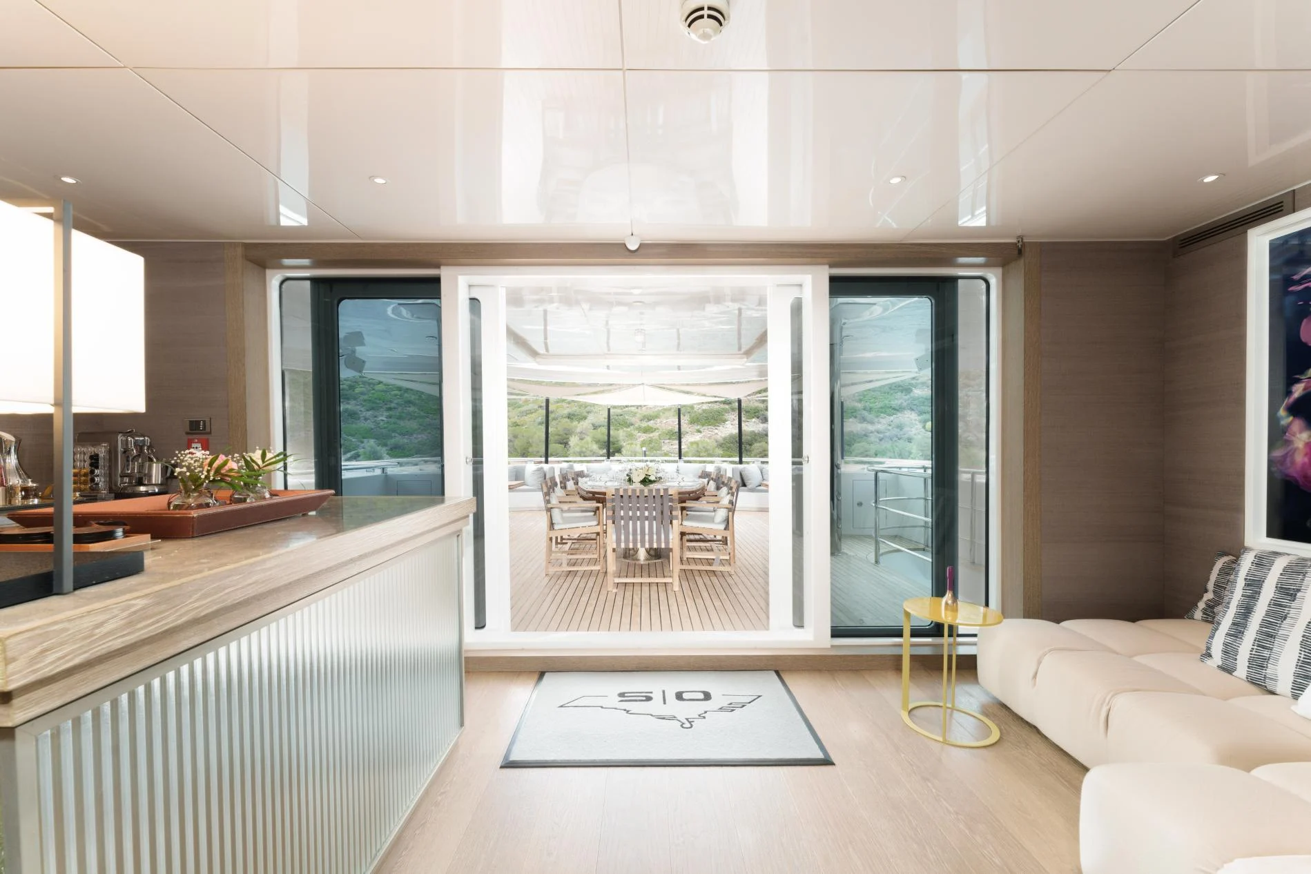 Main saloon looking aft to the dining room aboard a 47m superyacht charter — OS4712