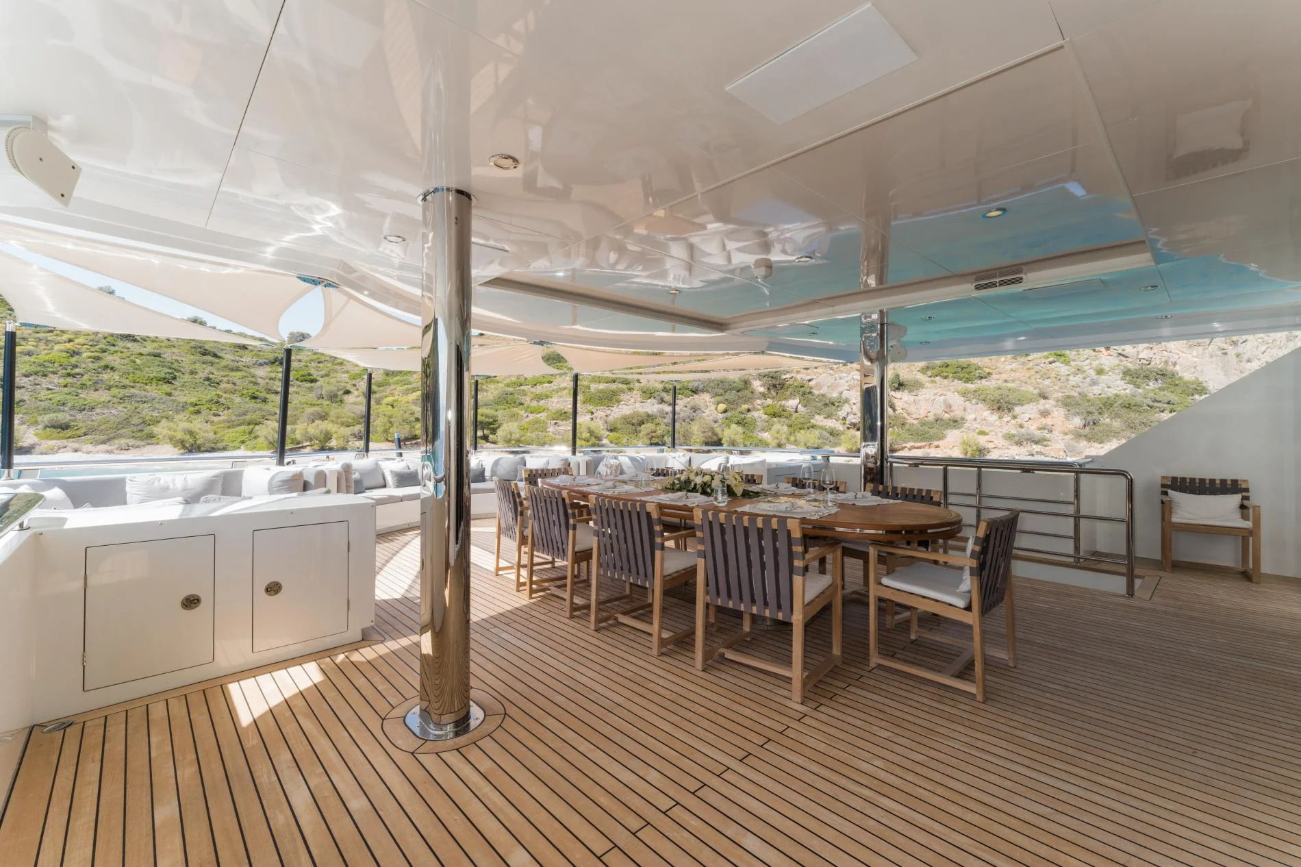 Shaded alfresco dining on the aft deck of a 47m superyacht charter — OS4712