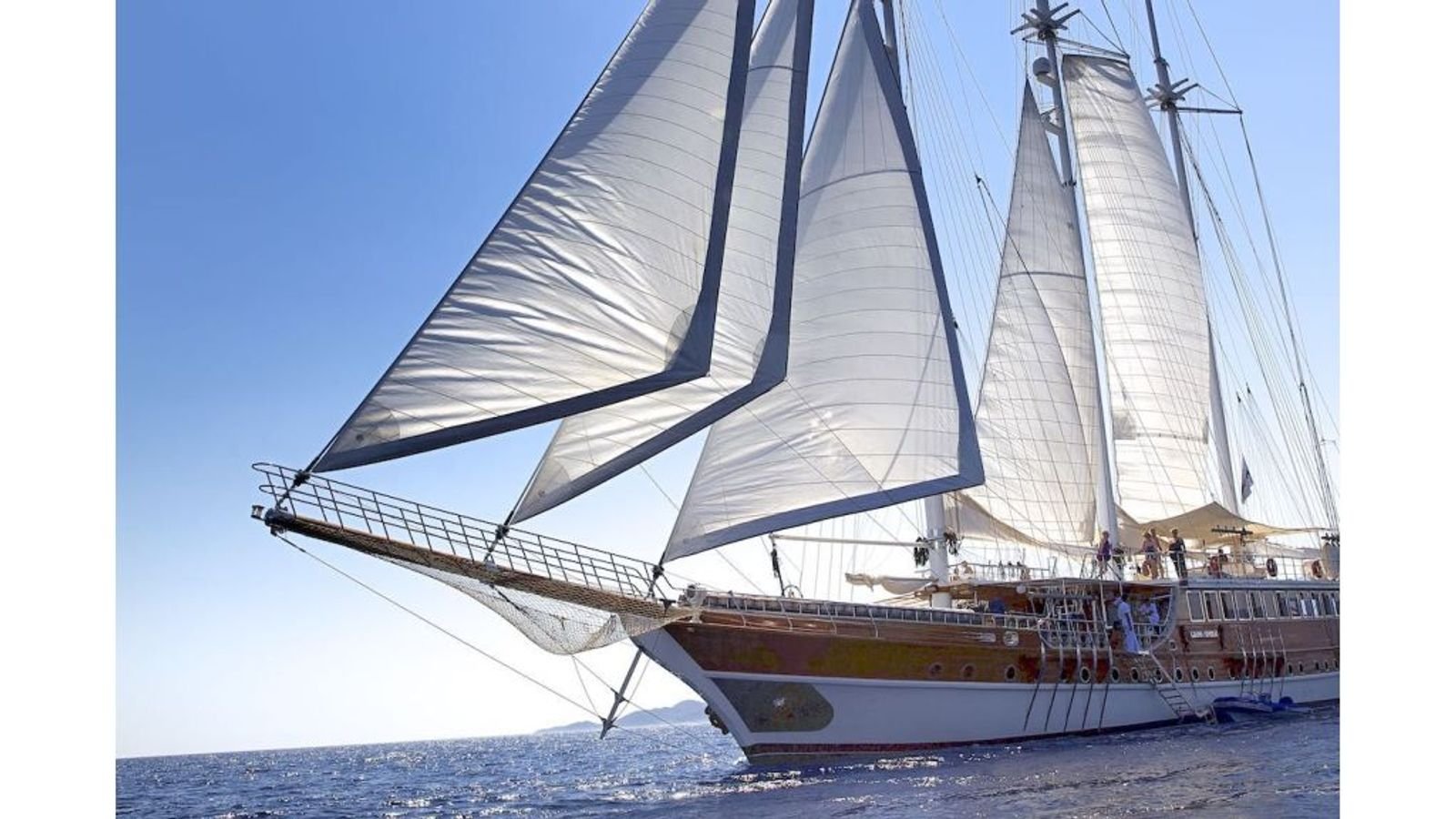 A 46m three-masted gulet charter Fethiye vessel under full sail