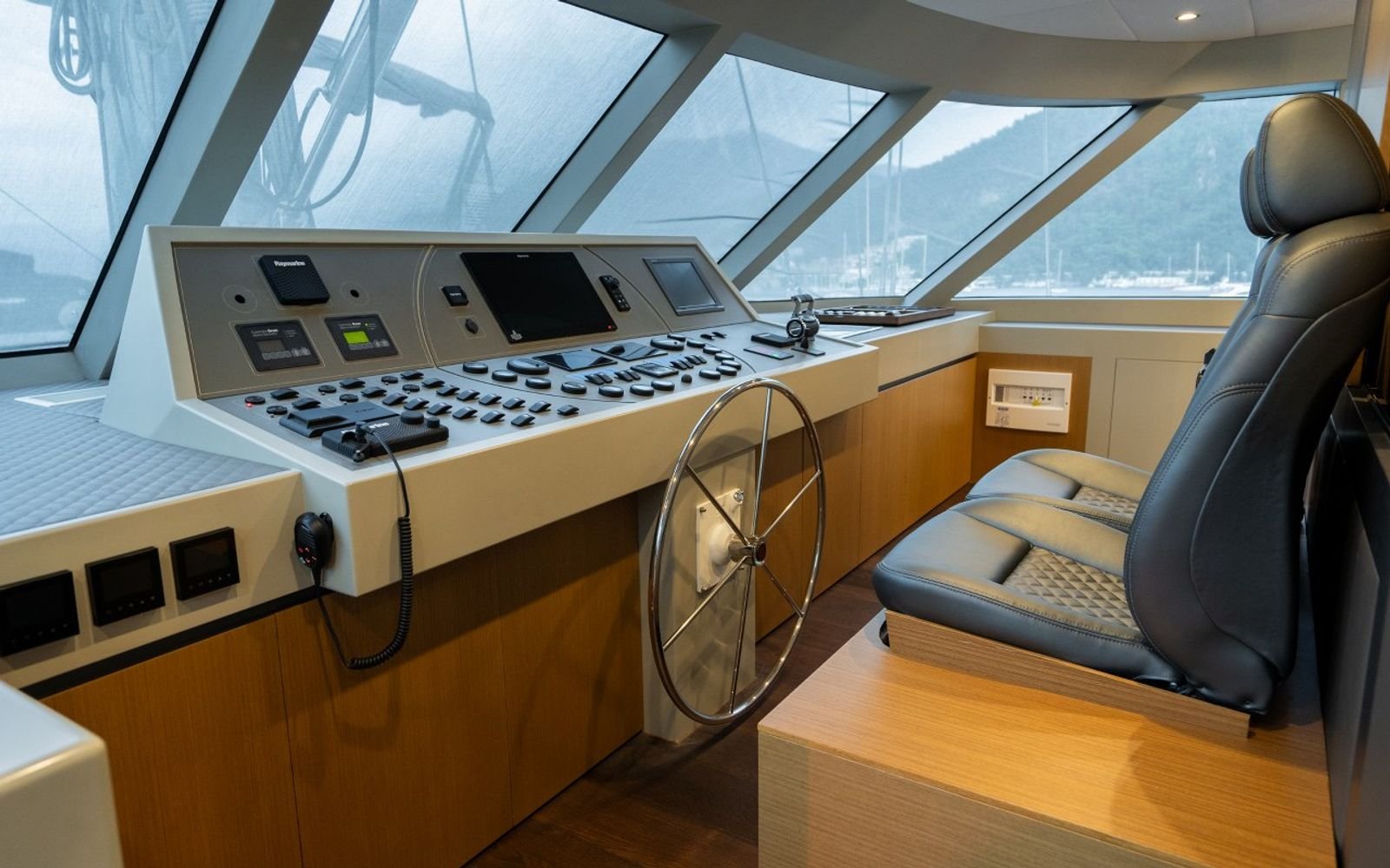 Wheelhouse and navigation bridge with helm seat on a luxury sailing yacht charter