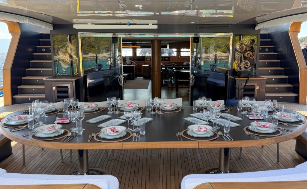 Elegant onboard dining setup aboard the 51m Motor Sailer Charter Bodrum OG5005