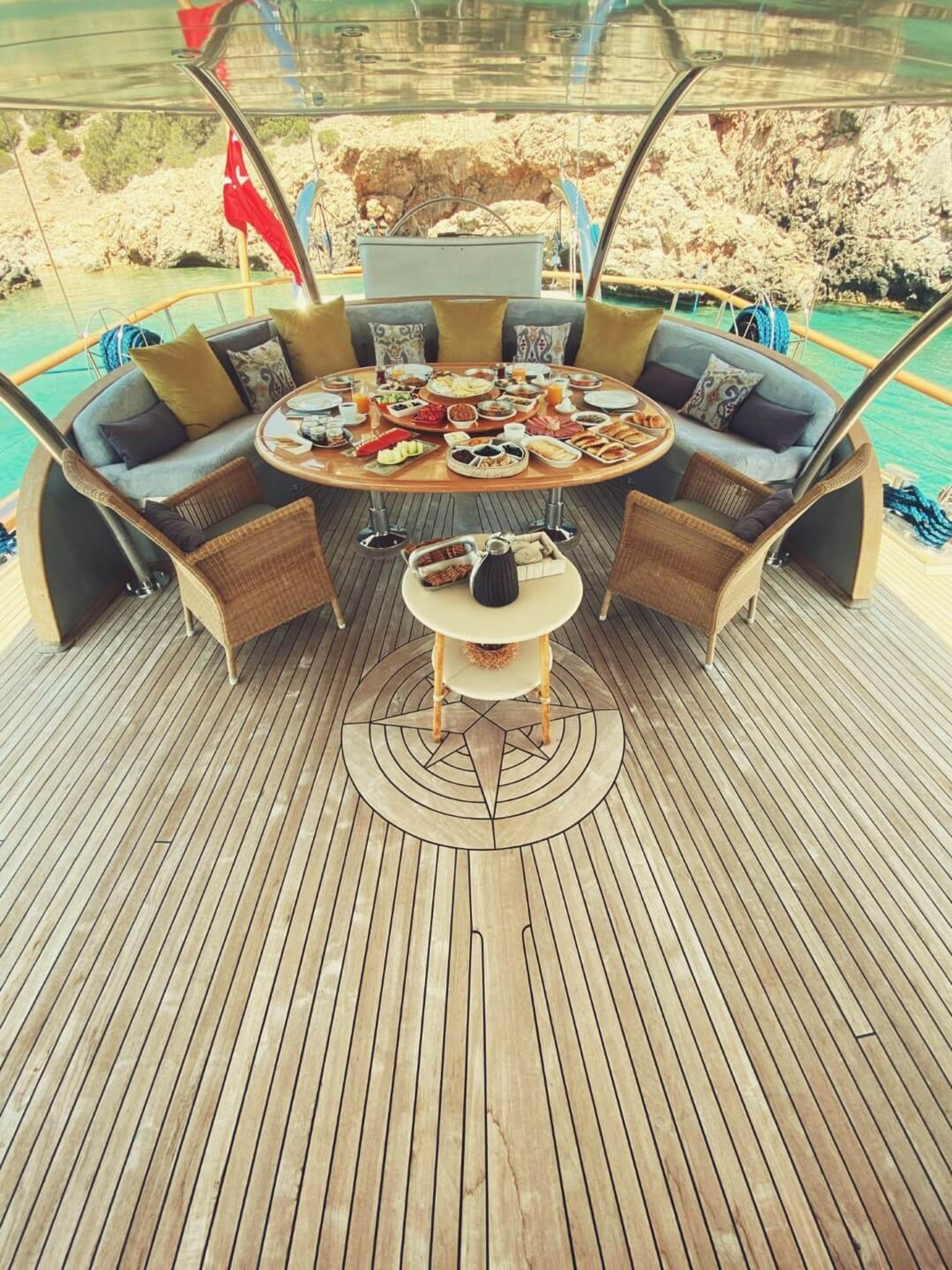 Aerial view of alfresco dining aboard the SM3610 motor sailer charter