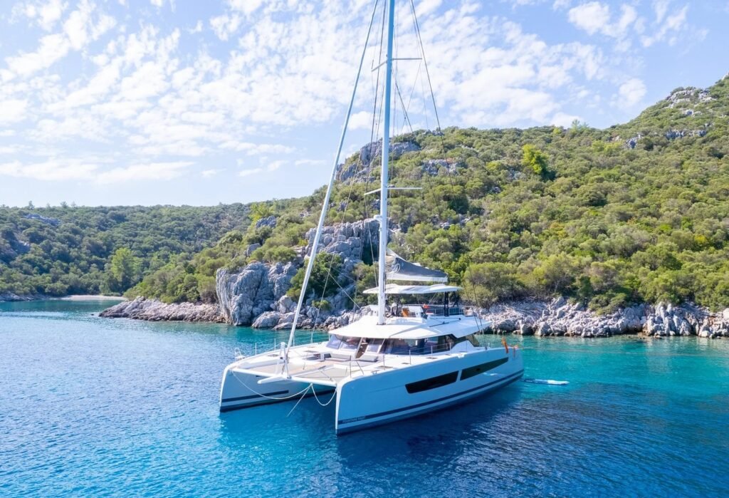 Fountaine Pajot Alegria 67 charter catamaran anchored along the Turkish coast near Bodrum