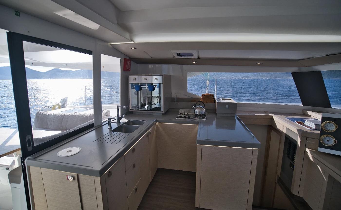 Galley of the Astrea 42 catamaran charter in Marmaris with gas hob, sink and worktop at saloon level