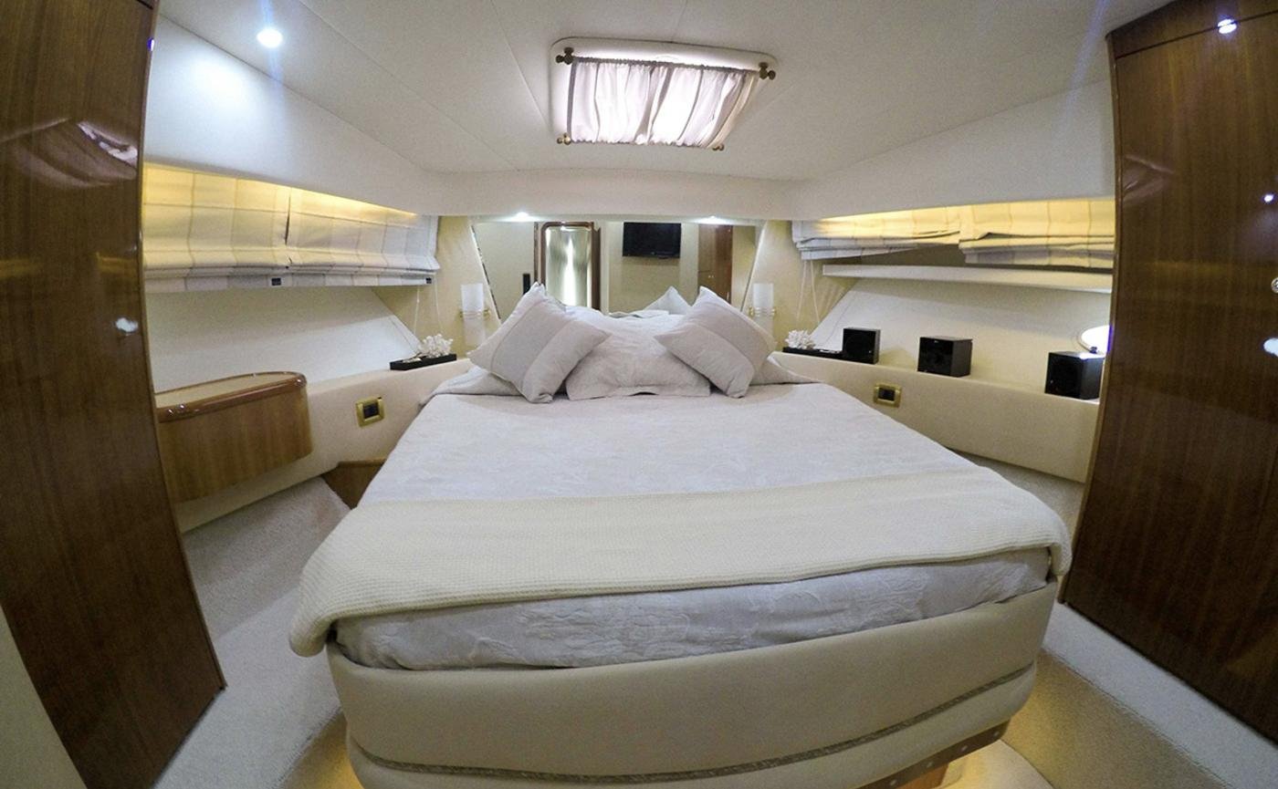 Master cabin with overhead hatch and wardrobes on an Azimut 58 motor yacht