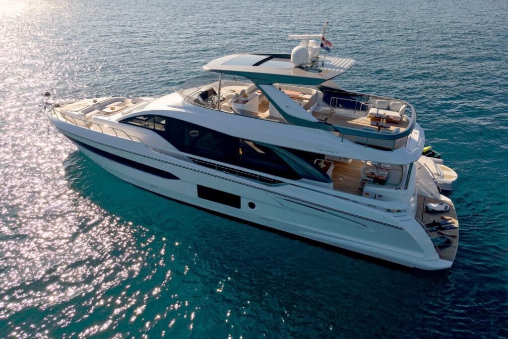 Motor yacht charter Split - aerial bow view of Azimut 78 Fly CO2404 at anchor off the Dalmatian coast