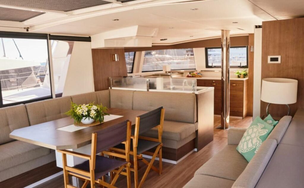 Bali 4.6 charter Marmaris — saloon dining table and galley