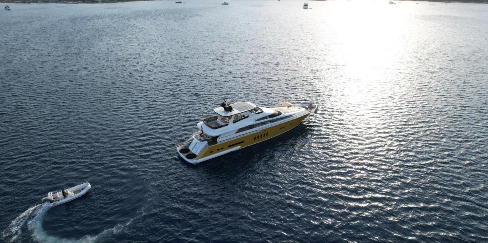 32m Bilgin 32 motor yacht at anchor with its tender in a Bodrum bay
