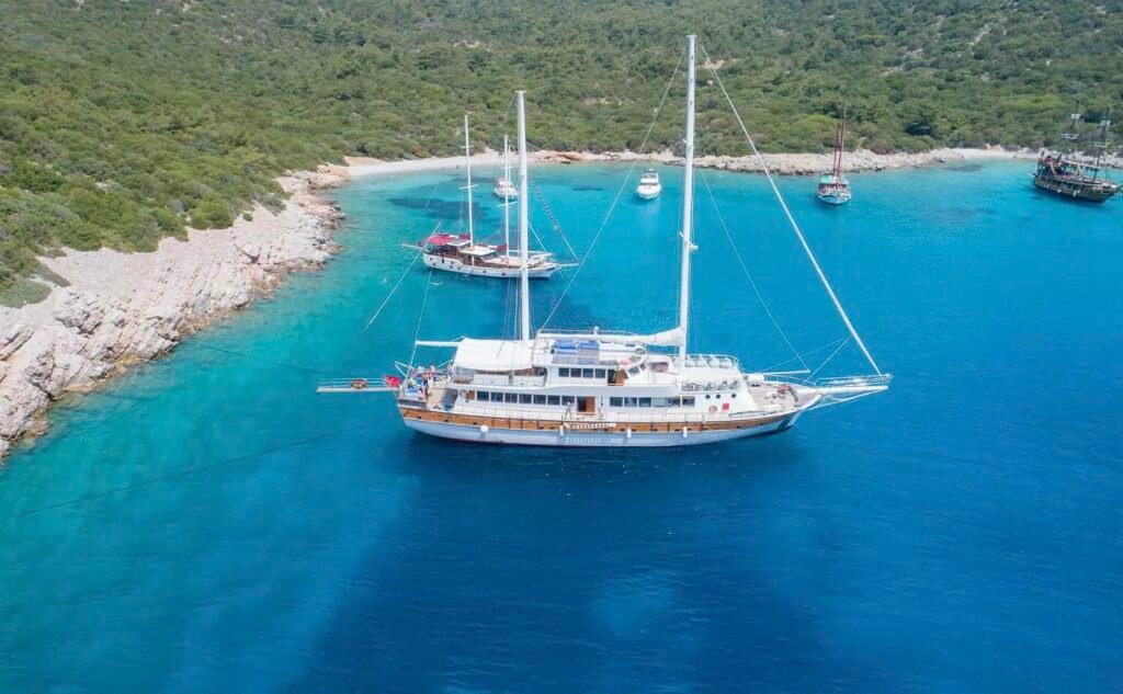 43m gulet anchored in a turquoise Aegean cove on a blue cruise from Bodrum