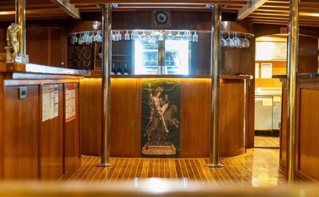 Saloon bar with glassware and a classical panel aboard a 43m Bodrum gulet