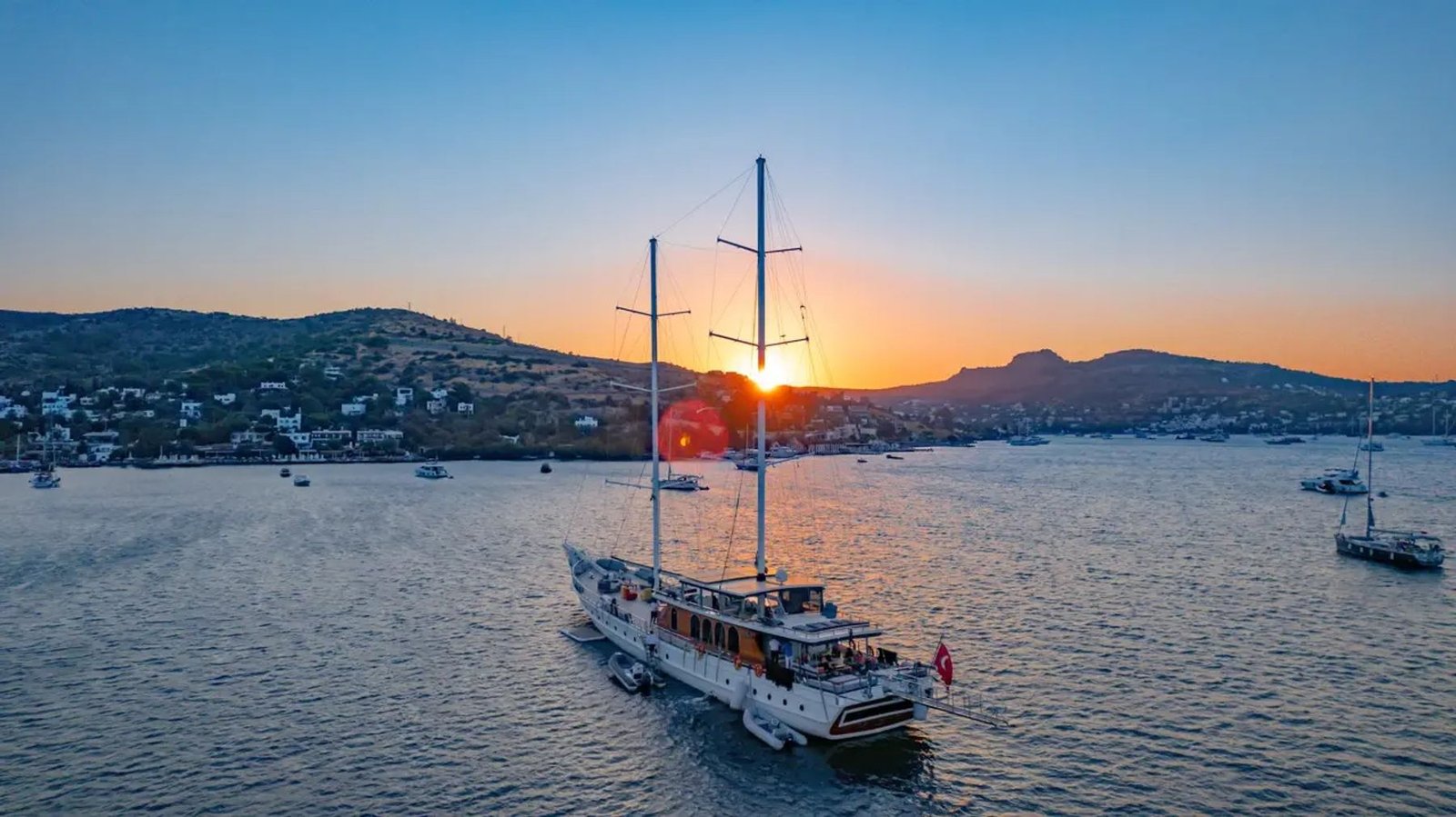 Grand gulet charter Bodrum CA4007 - twin masts silhouetted at sunset