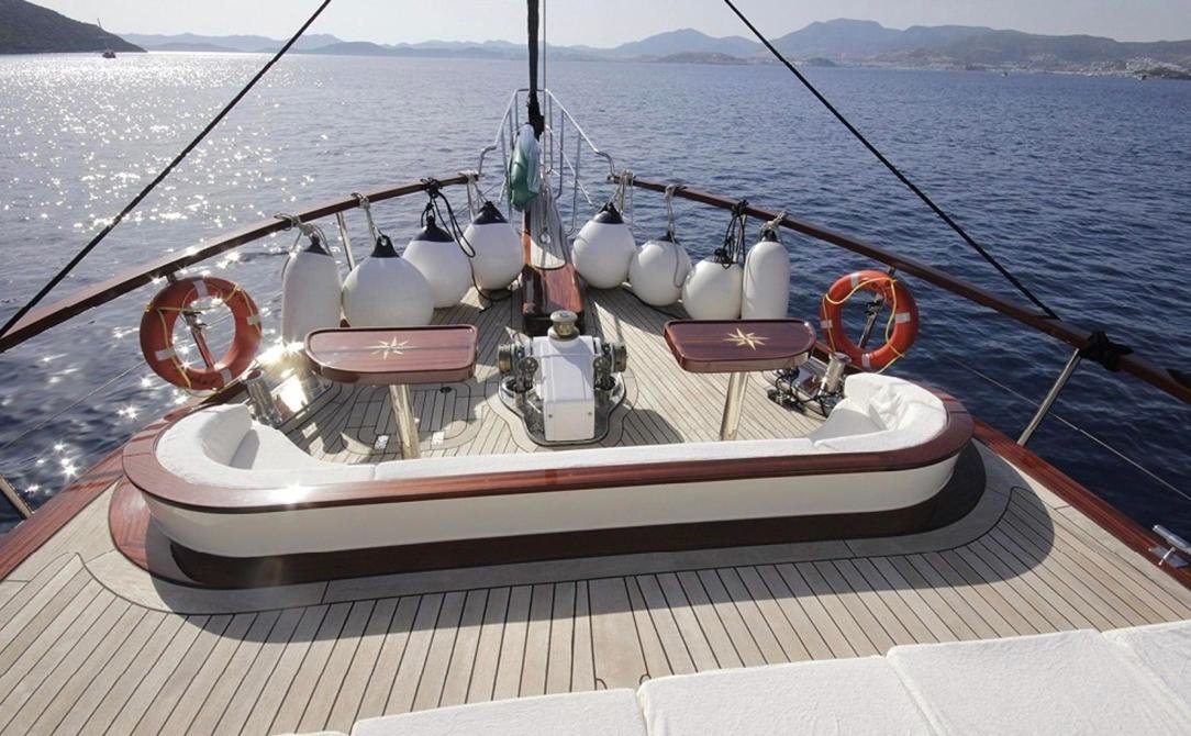 Contemporary gulet charter Bodrum - foredeck lounge with inlaid star tables