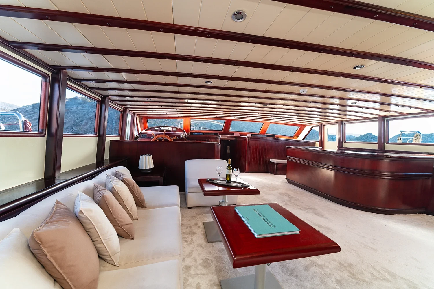 Second angle of the saloon aboard a crewed motor yacht charter in Gocek with panoramic windows