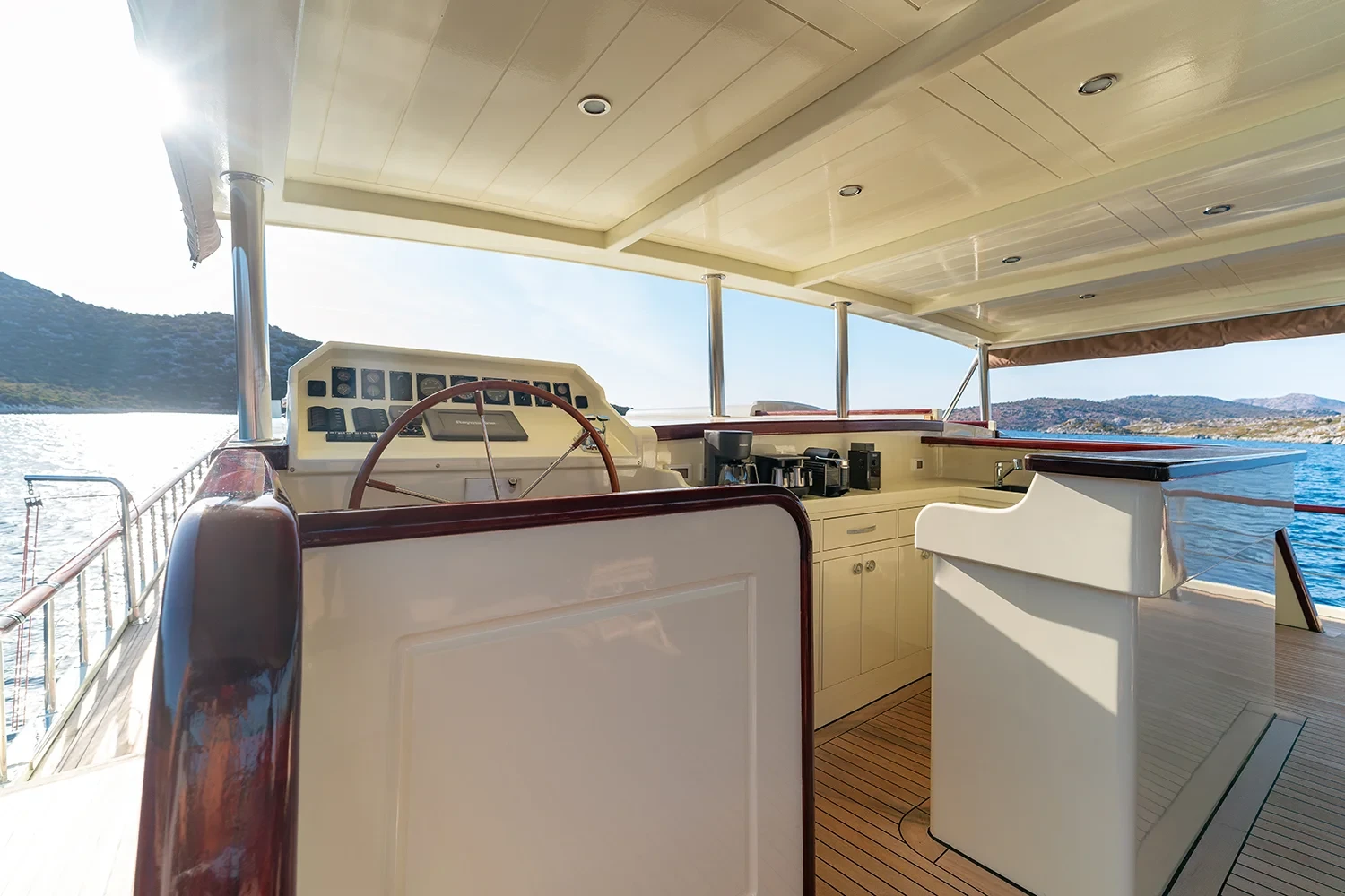 Upper helm station aboard a crewed motor yacht charter in Gocek with full navigation electronics