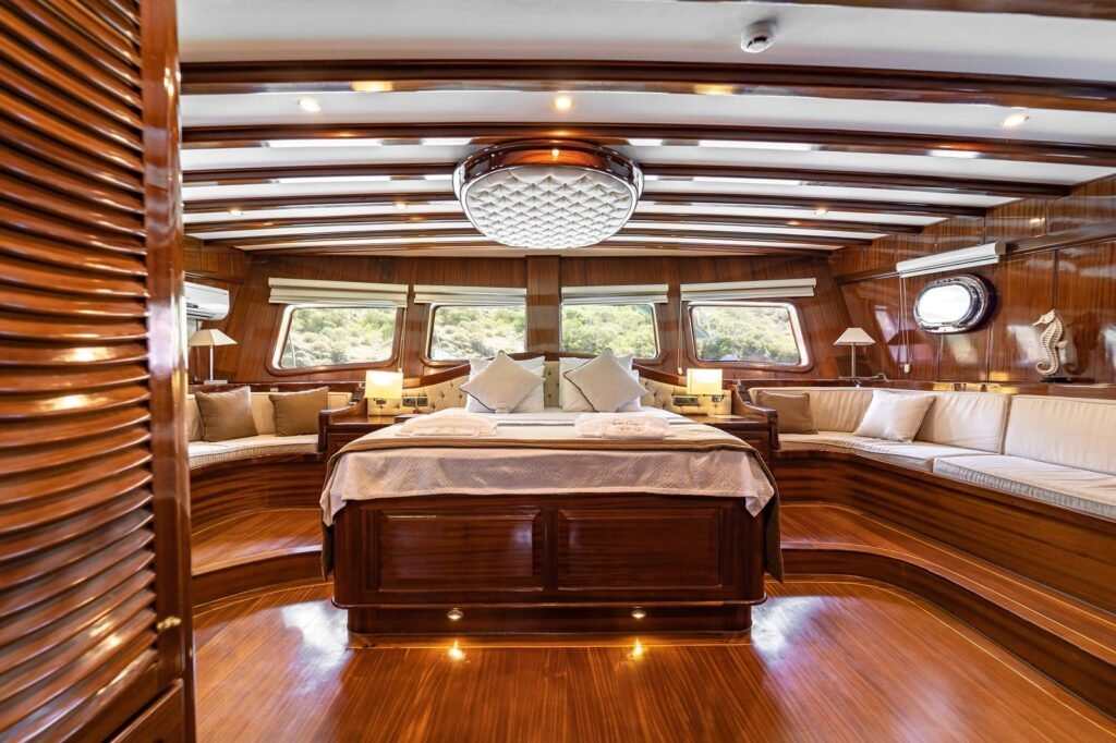 Master suite aboard the LQ3708 deluxe gulet charter Fethiye, finished in dark timber