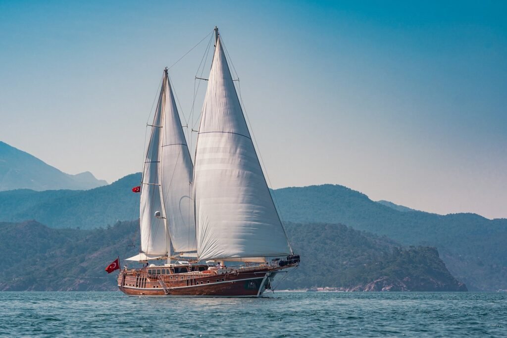 LQ3708 deluxe gulet charter Fethiye at anchor in a pine-fringed Göcek bay