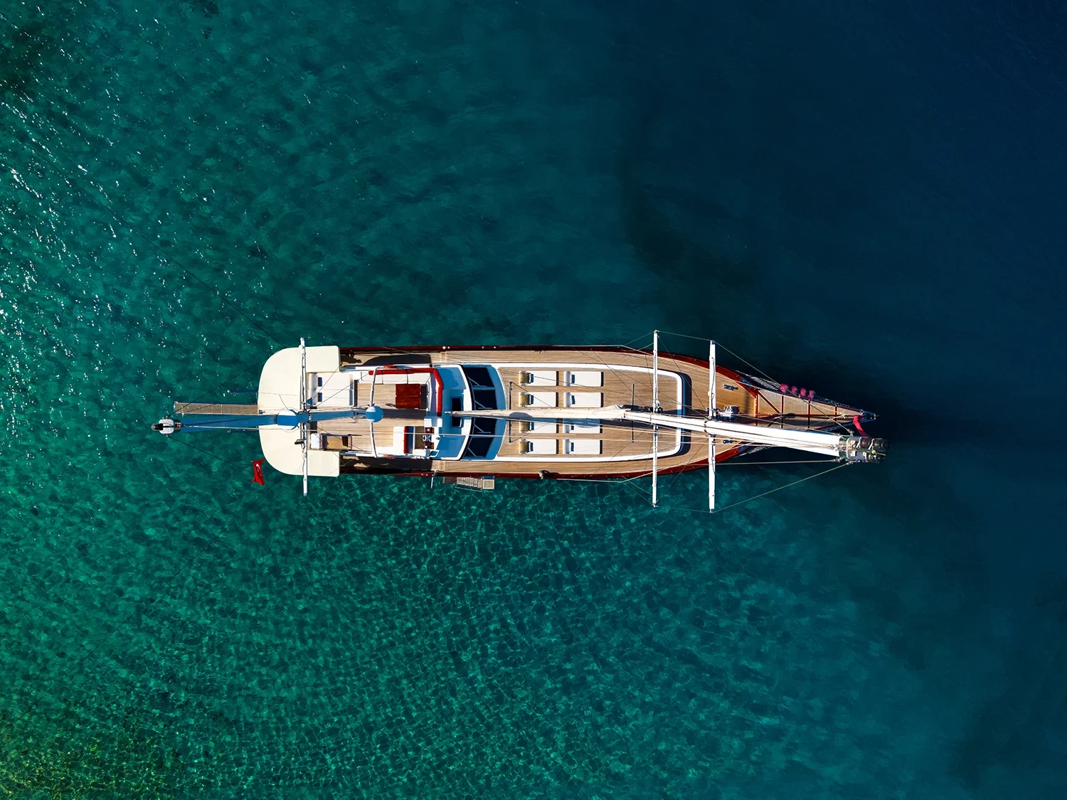 Deluxe motor sailer charter Gocek aerial angled view of the sailing yacht at anchor