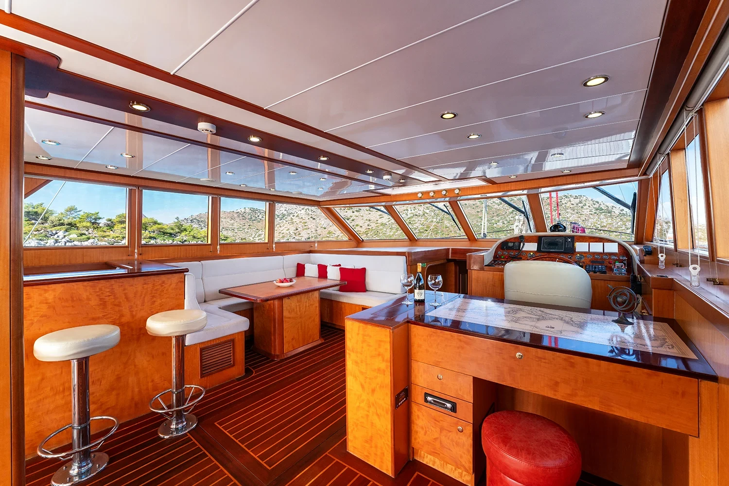 Deluxe motor sailer charter Gocek interior bar and galley with wood joinery