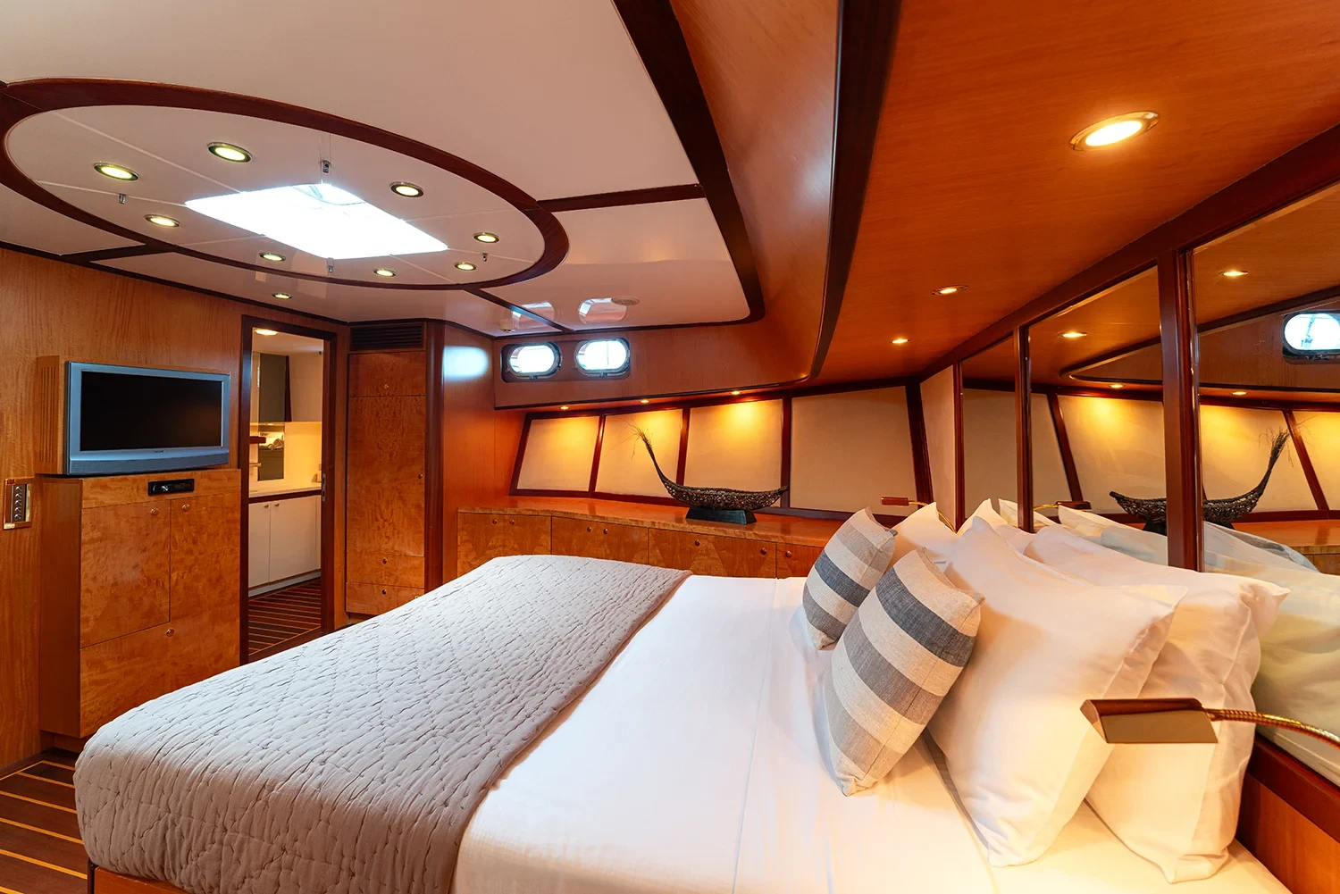 Deluxe motor sailer charter Gocek full-beam master cabin with skylight and vanity