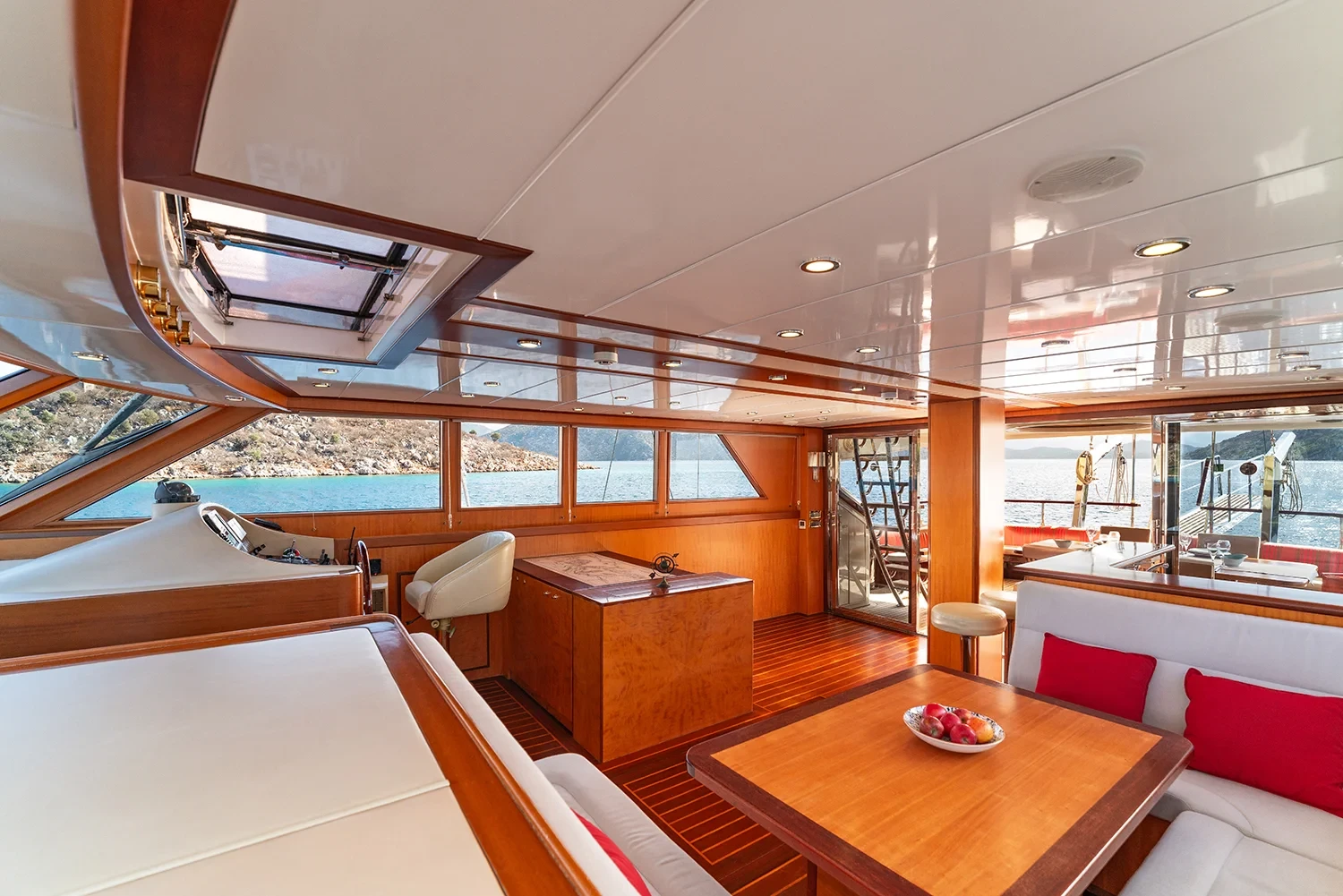 Deluxe motor sailer charter Gocek main saloon with dining table and panoramic windows