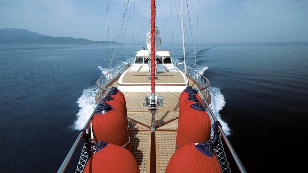 Aerial view over the bow of a 26m motor sailer under way in Turkey