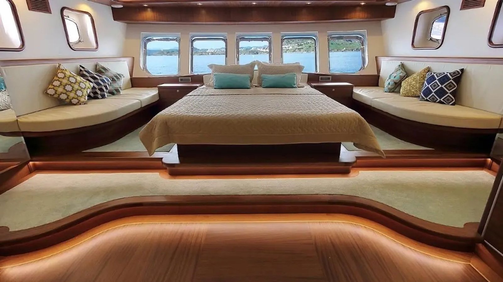 Master cabin aboard the motor sailer with double bed and ambient lighting