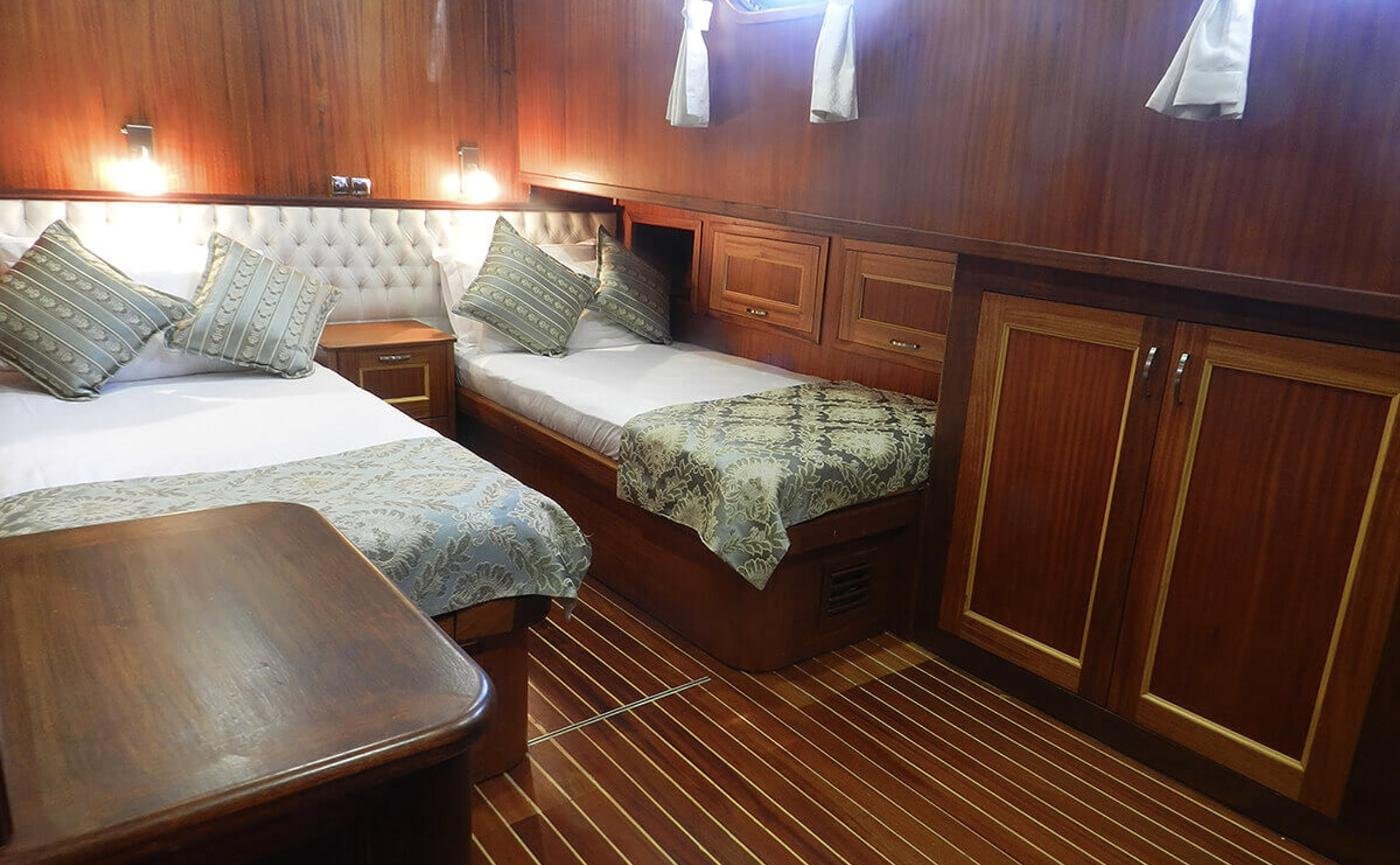 Elegant gulet charter Bodrum - guest cabin with a double and a single berth