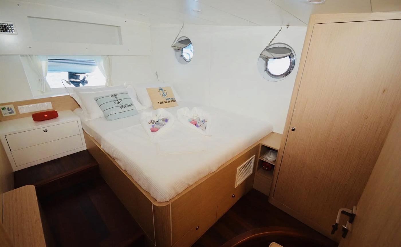 Double cabin turndown with towel art on a family gulet charter Bodrum