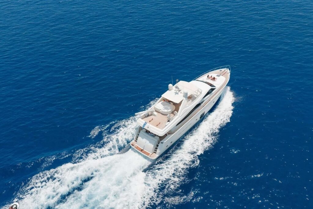 Ferretti 830 Fly charter Rhodes underway off the Dodecanese coast, seen from the air on the bow quarter