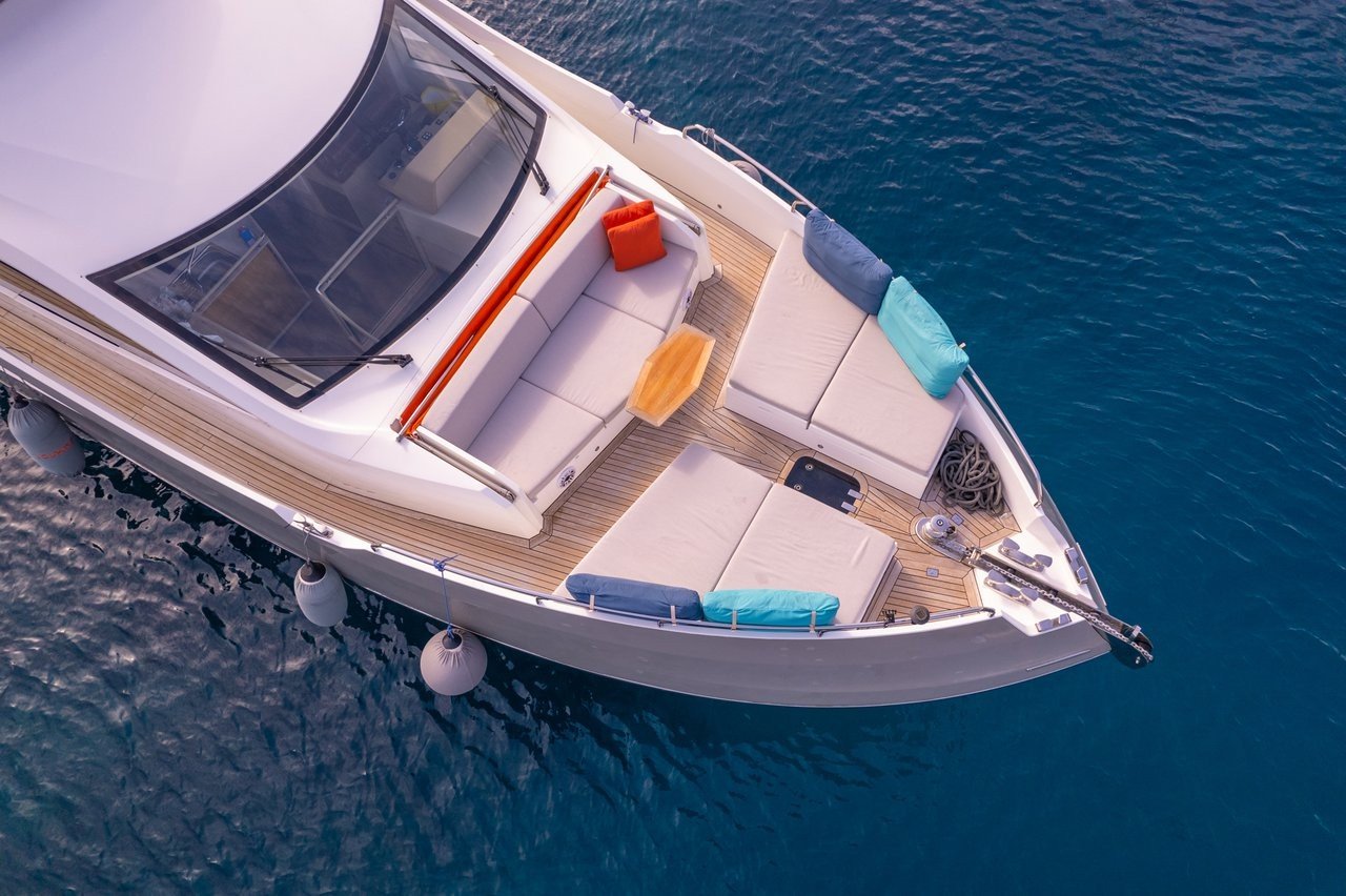 Top-down aerial view of a flybridge motor yacht showing sundeck and bow layout