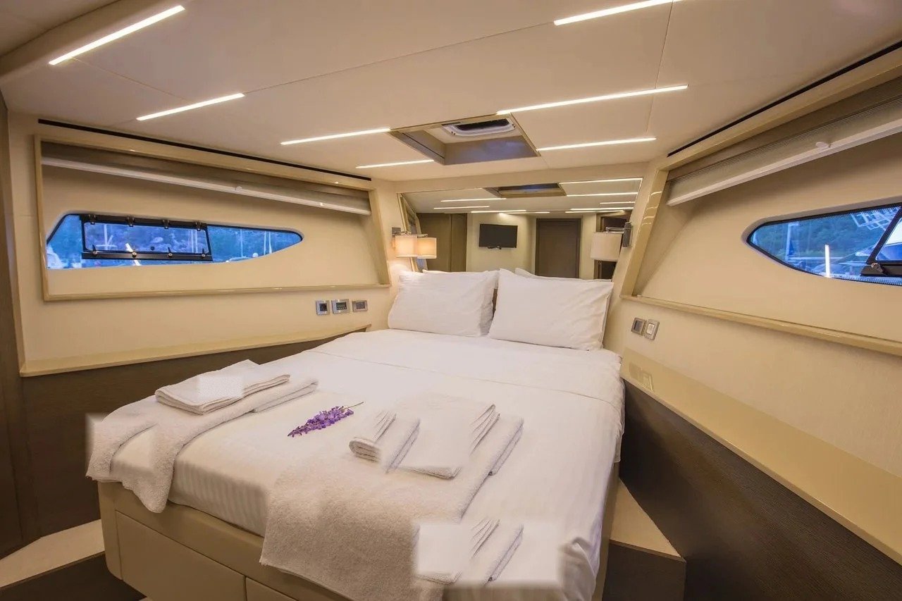 Second guest cabin with double bed aboard a flybridge motor yacht charter in Göcek, Turkey