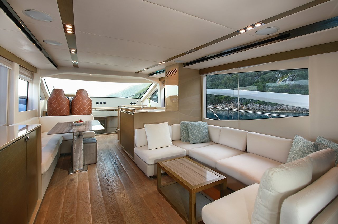 Main saloon lounge seating aboard a flybridge motor yacht charter in Göcek, Turkey