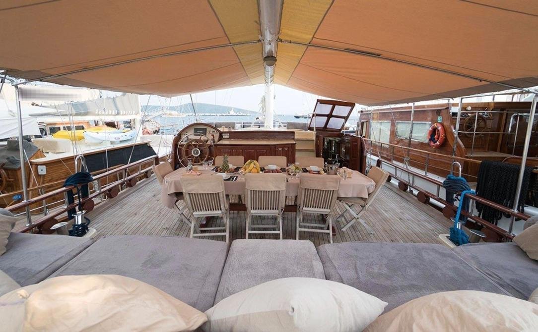 Intimate gulet charter Bodrum - aft deck sunbeds looking forward to the table