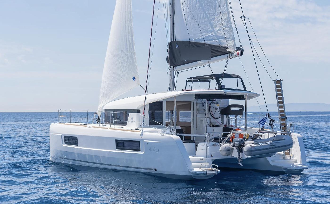 Lagoon 40 catamaran at anchor with tender on davits
