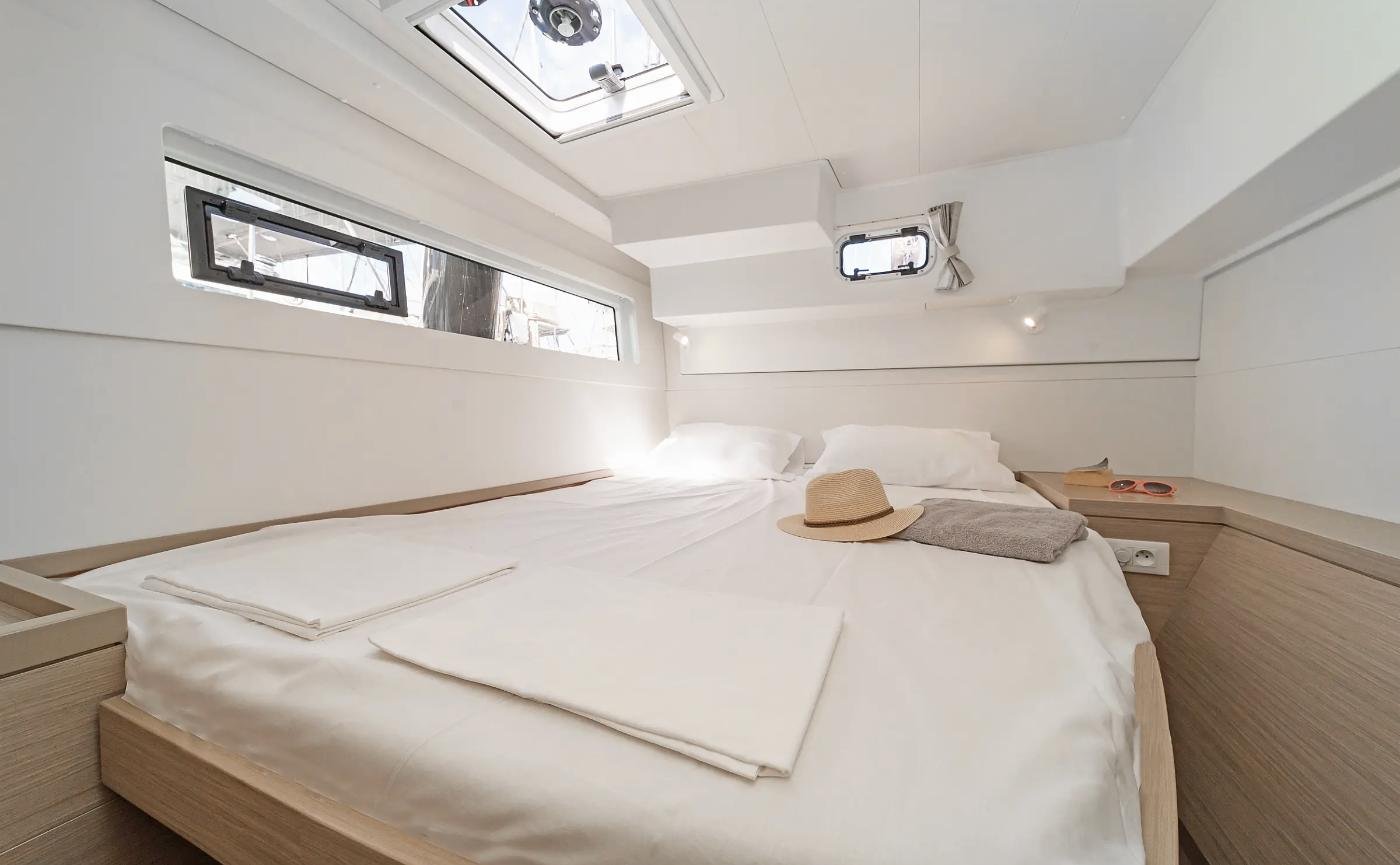 Forward double cabin with hull window on a Lagoon 40 charter catamaran
