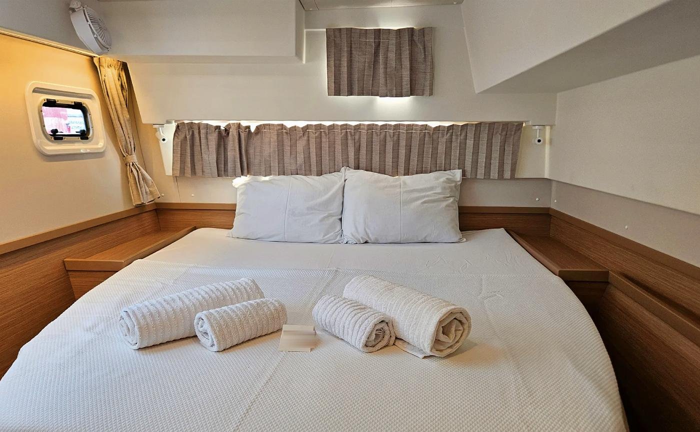 Double guest cabin with island berth aboard the Lagoon 42 catamaran charter in Marmaris