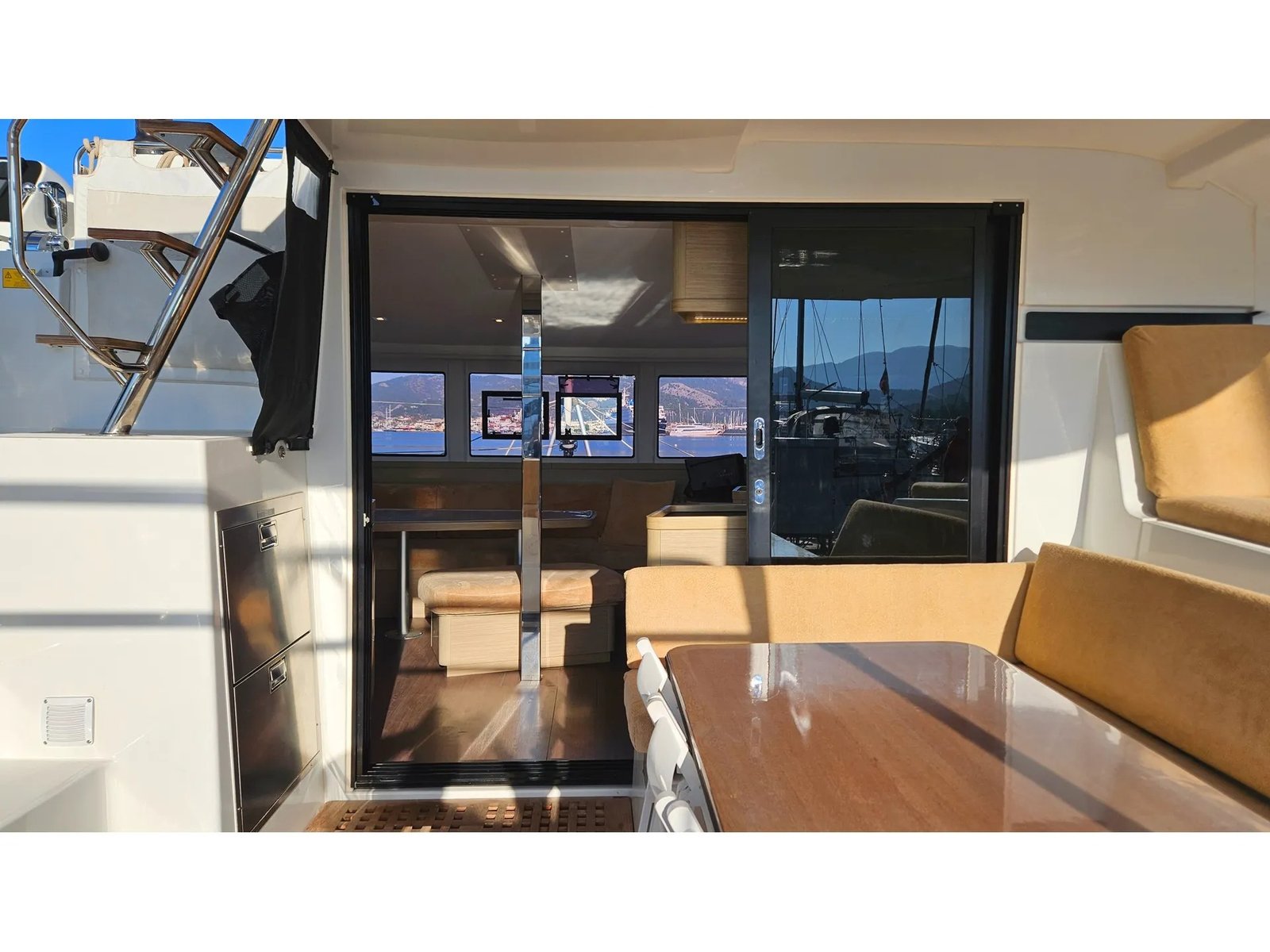 Lagoon 42 catamaran charter Marmaris helm station interior with navigation electronics and panoramic windows
