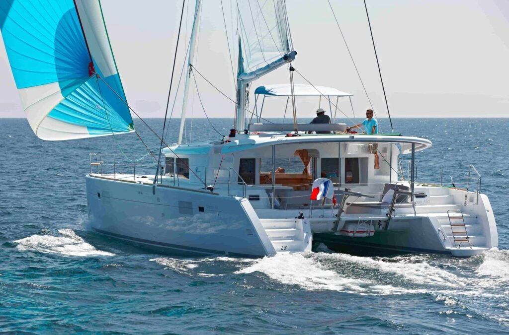 Lagoon 450 catamaran charter Rhodes - TH1406 sailing under spinnaker, bareboat charter from Rhodes with Aquinox Yachting