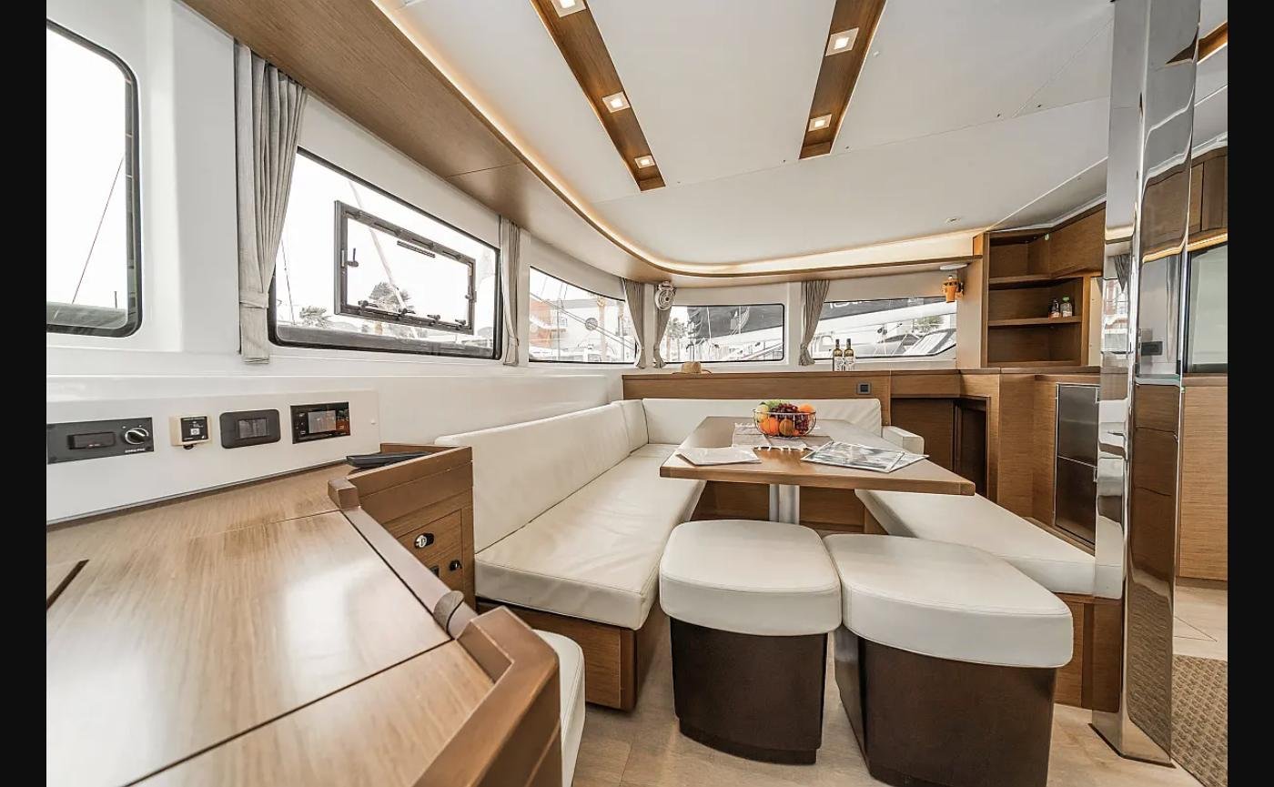 Lagoon 46 catamaran charter Kos — saloon interior with dining table