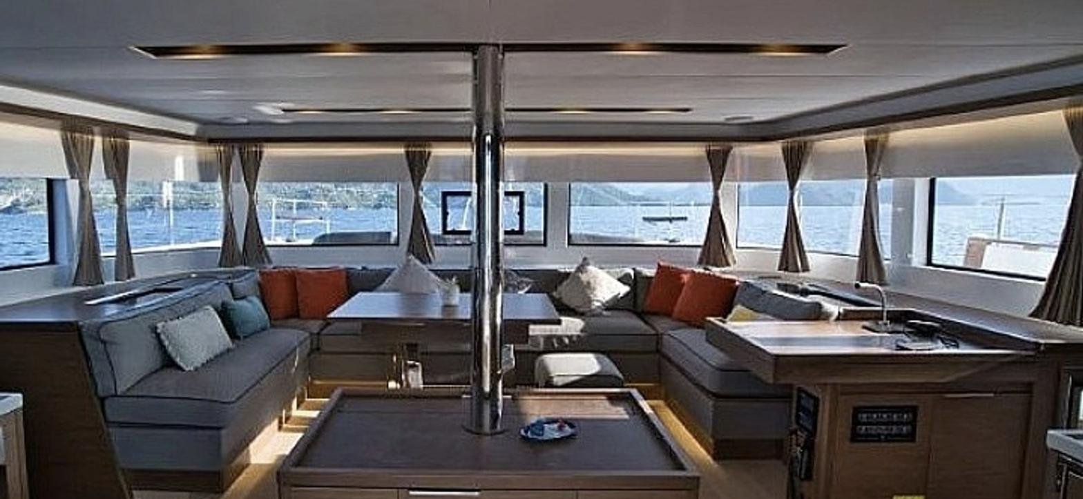 Panoramic saloon with wraparound seating on a Lagoon 50 charter Rhodes