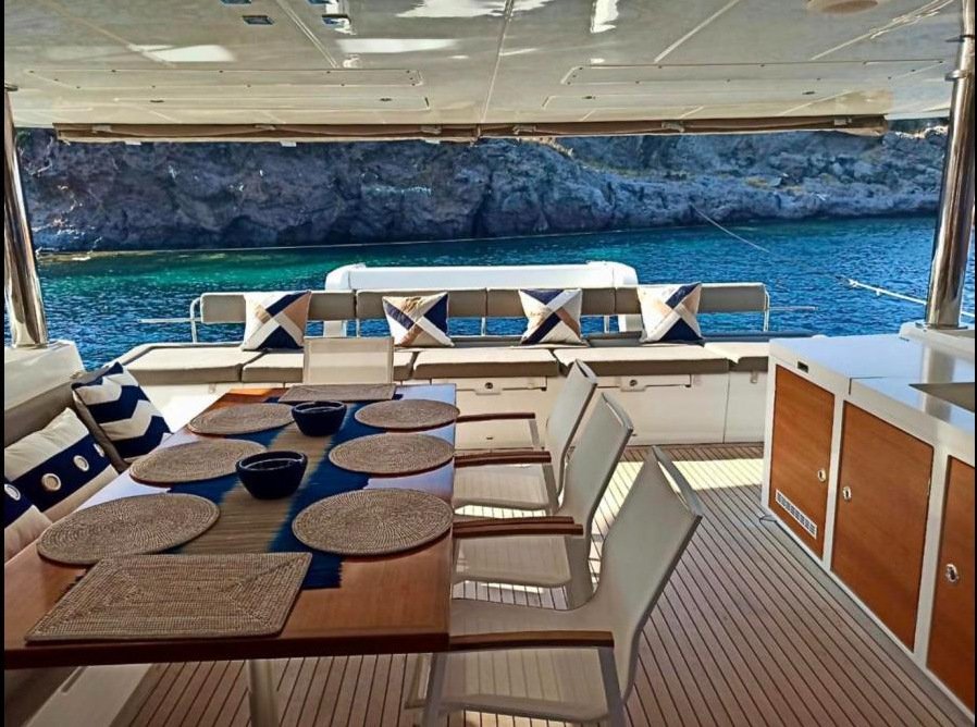 Cockpit dining table set for 8 guests on a Lagoon 620