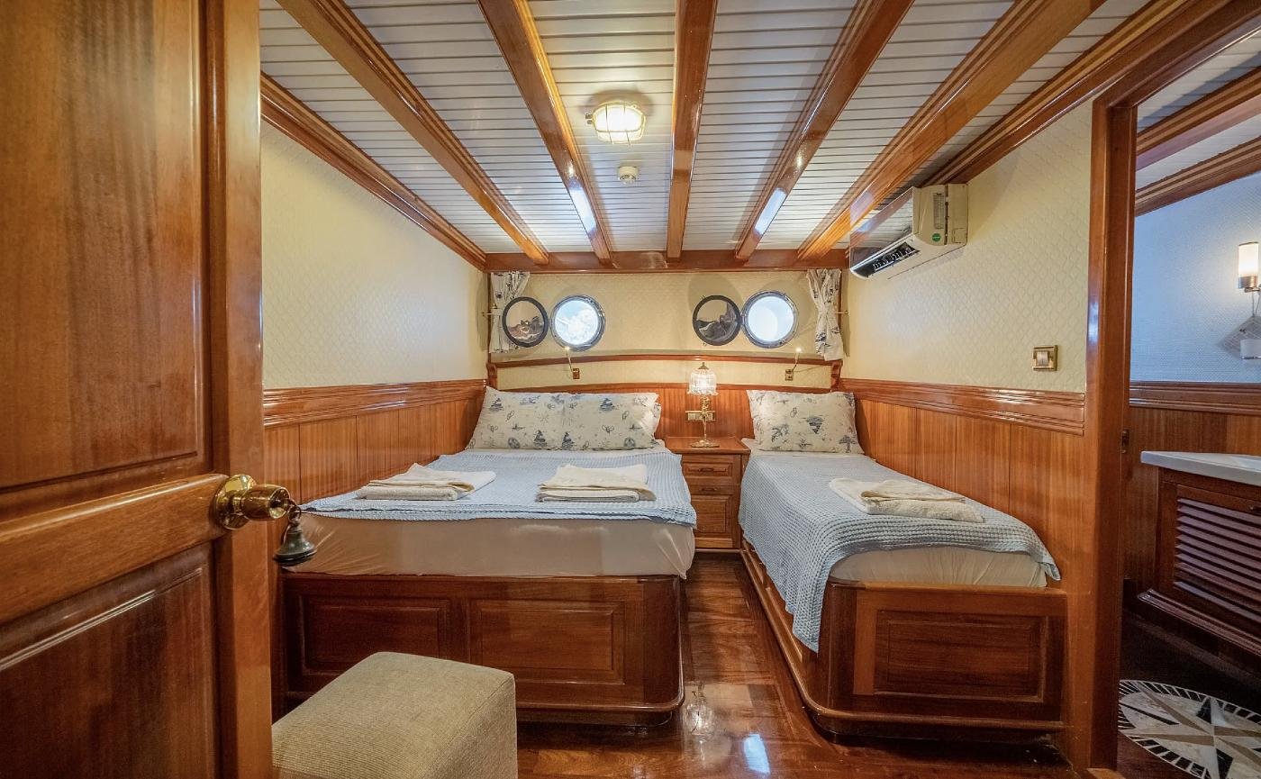 Triple cabin with double and single berths aboard a 47m gulet, Bodrum