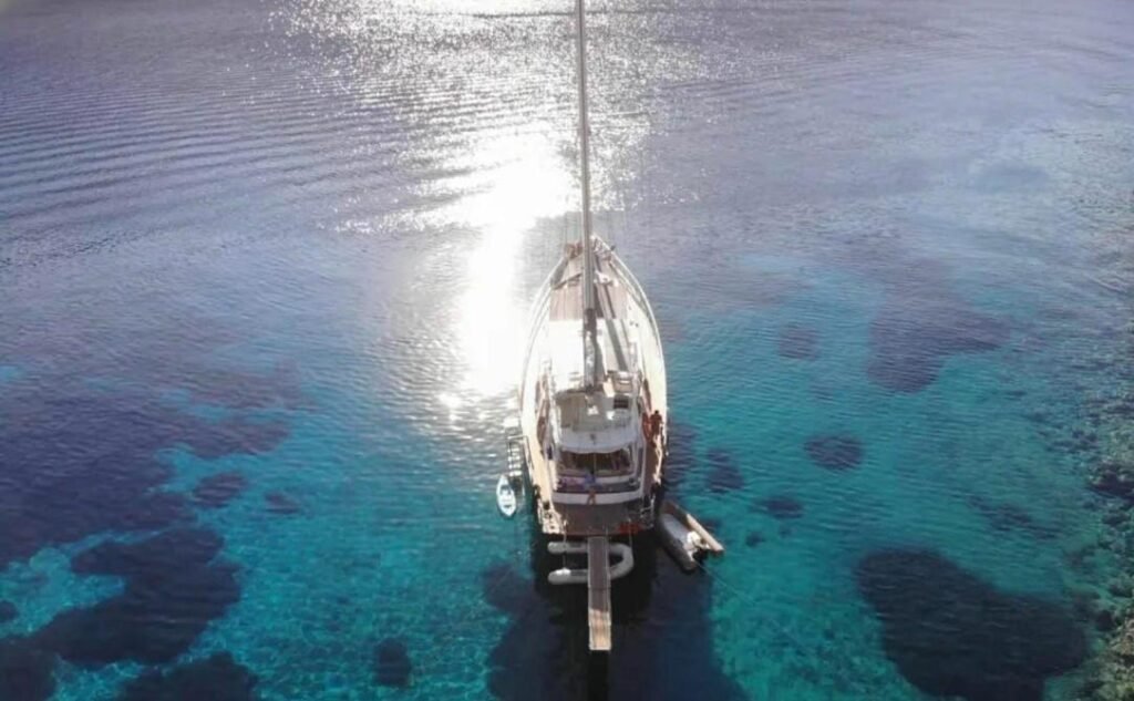 Luxury gulet charter Göcek — aerial from astern showing the teak decks