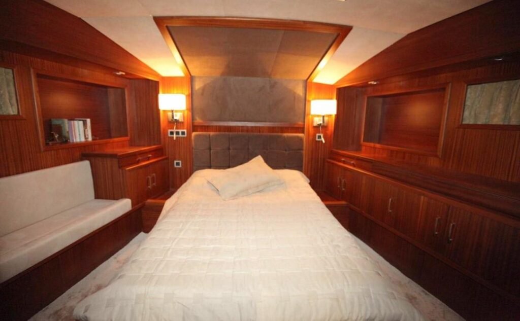 Luxury gulet charter Göcek — master cabin in polished mahogany